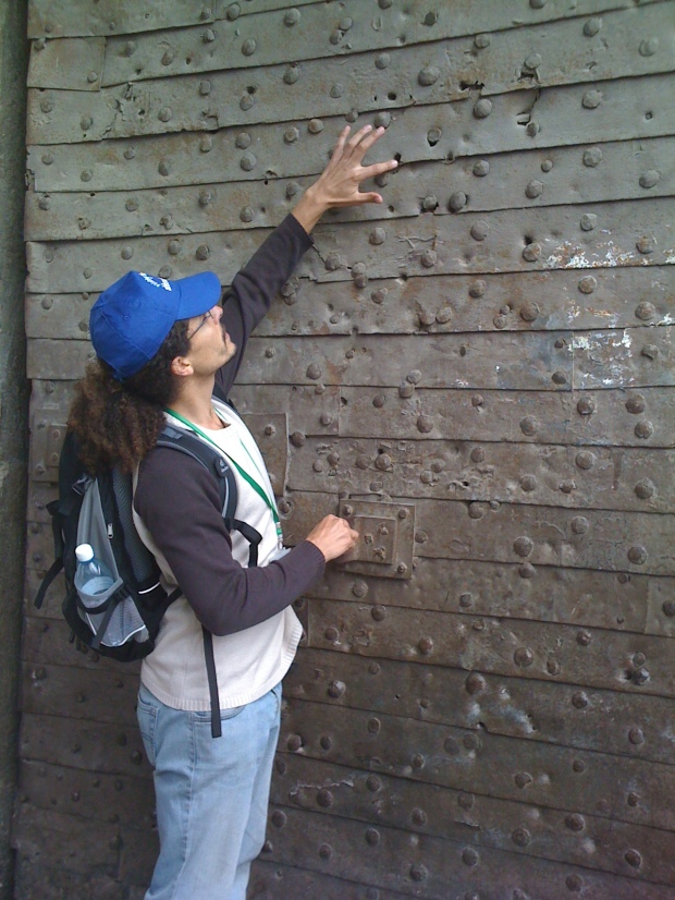 Our guide pointing to the bullet holes from the 1967 war in the Lion's Gate - Old City Jerusalem
